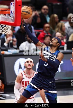 Minnesota Timberwolves forward Jaden McDaniels (3) drives past Dallas