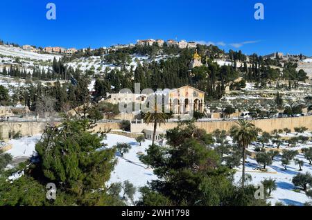 Scenic wintry landscape with snow-covered hills, mountains, and trees: Mount Of Olives , Jerusalem Stock Photo