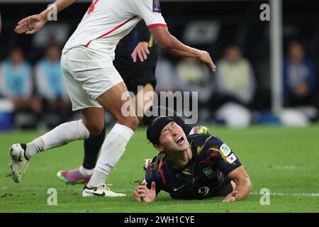 DOHA, QATAR - FEBRUARY 6: Cho Gue-sung of South Korea lays on the floor injured during the AFC Asian Cup semi final match between Jordan and South Korea at Ahmad Bin Ali Stadium on February 6, 2024 in Doha, Qatar. (Photo by MB Media/) Stock Photo