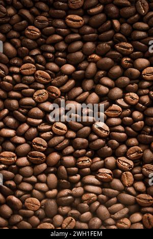 Fresh Roasted Coffee Beans Rustic Background. Coffee Beans in a pile Stock Photo