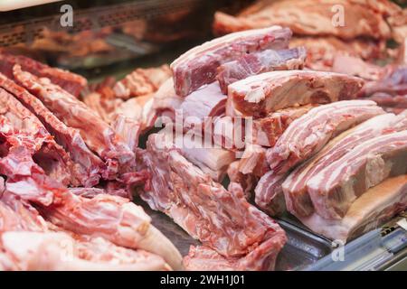 Butcher shop with meat packs. Different products in meat market. Meat counter Stock Photo