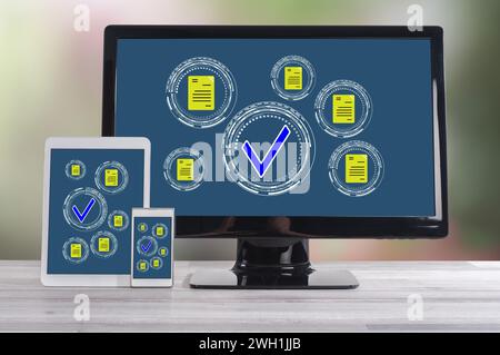 Document validation concept shown on different information technology devices Stock Photo