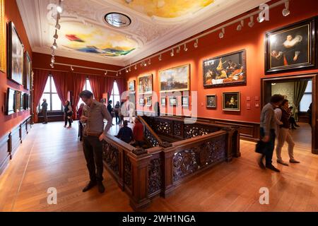 Wooden decorated staircase with beautifully painted ceiling in the Royal Cabinet of Paintings 'Mauritshuis' in the Dutch city of The Hague Stock Photo