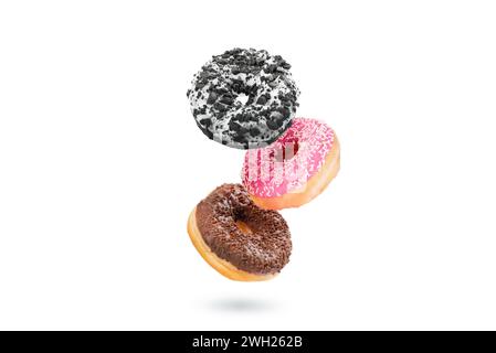 Delicious donut on white background. Mix of flying multicolored doughnuts Stock Photo