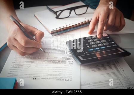 Tax time, tax concept with man filling tax form. Business income. Stock Photo