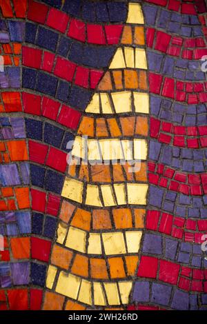 Sheffield UK – 13 Nov  2021: Close up on the colourful mosaic tiles in the dry channel of a defunct water feature Mosaic Rill by Emma Biggs Stock Photo