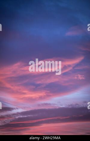 Pink and purple colours of the sunsetting sky, London, England, UK Stock Photo