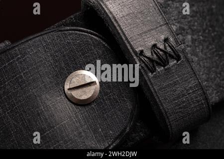 Part of a purse or purse made of black genuine leather. Stock Photo