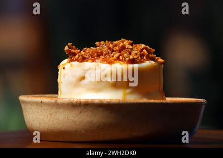 A delectable white chocolate cake oozing with rich dulce de leche and smothered in a luscious chestnut caramel coating Stock Photo