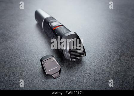 A beard trimmer with a nozzle. Facial hair care Stock Photo