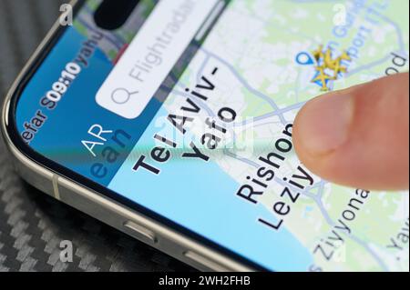 New York, USA - January 24, 2024: Air traffic in Tel Aviv city  on iphone 15 pro max screen close up view Stock Photo