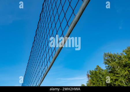 beach volleyball net against the blue sky on the beach in summer Stock Photo