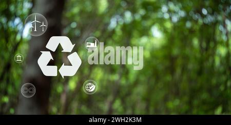 Recycle symbol on green bokeh background. Ecological and save the earth concept. An ecological metaphor for ecological waste management and a sustaina Stock Photo