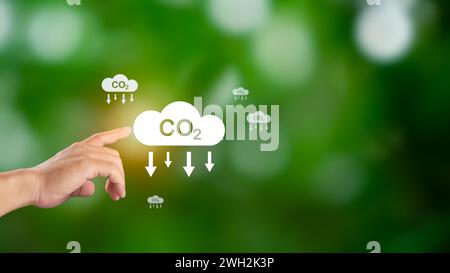 Hand holding CO2 reducing icon for decrease carbon dioxide emission ...
