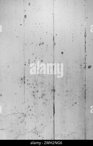Texture of grey concrete wall where imprints of the formwork can still be seen. Stock Photo