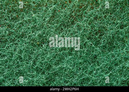 Close up of texture of green side of a rub sponge as a background. Stock Photo