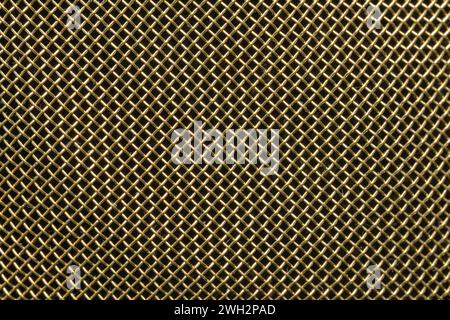 Close up of texture of woven brass metal sheet as a background. Stock Photo
