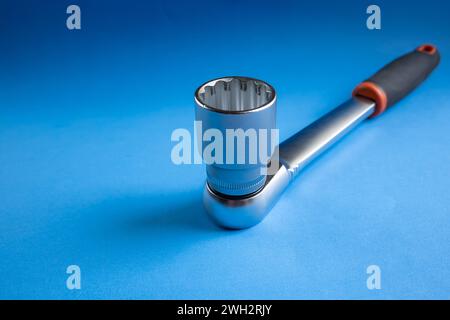 Ratchet wrench on blue background Stock Photo