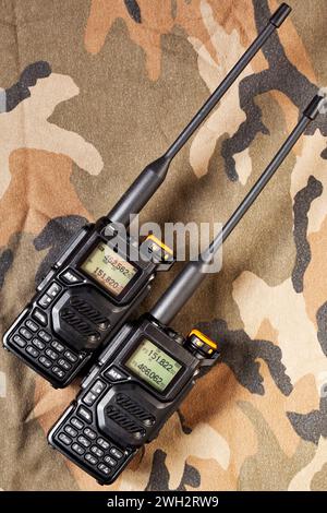 Set of two-way radios on camouflage background Stock Photo