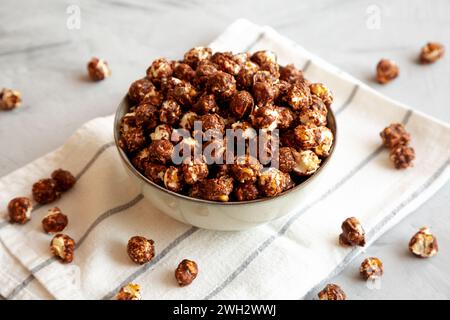 Homemade Chocolate Caramel Popcorn in a Bowl, side view. Stock Photo