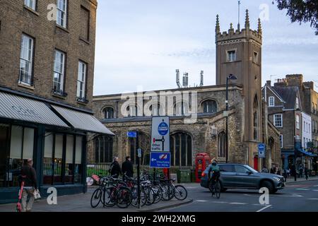 Modern telecoms towers next to the old 13th century St Clements Church in Cambridge Stock Photo
