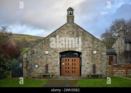 Front elevation view of The village hall built in 1999 in West Burton. North Yorkshire, UK Stock Photo