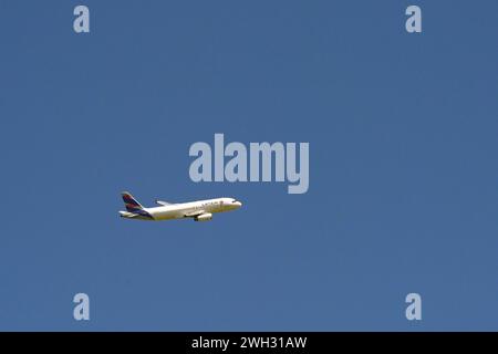 Cartagena, Colombia - 24 January 2024: Airbus jet operated by the LATAM Airlines Group climbing after take off against a deep blue sky Stock Photo