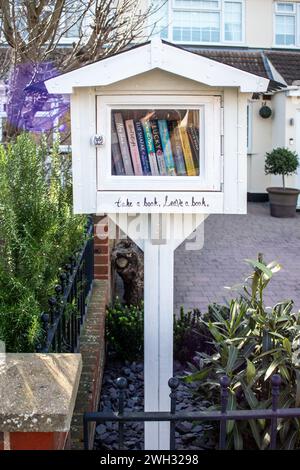 Roadside Library Little Free Library (roadside community Library) on the front garden ...