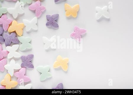 Colorful sugar sprinkles on white background Stock Photo
