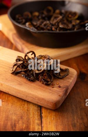 Chili chips. In Mexico called Chicharron de Chile. Crispy chili fried in olive oil with spices, easy homemade snack recipe, ideal to accompany tacos, Stock Photo