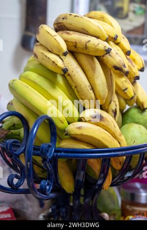 Photo of  yellow bananas on a table in a bascket Stock Photo