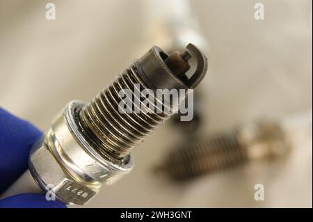 Used gasoline engine spark plugs close-up. Stock Photo