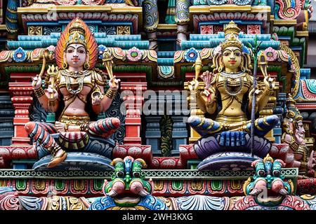 Colored decorations and statues, Hindu temple, Bangkok. Stock Photo