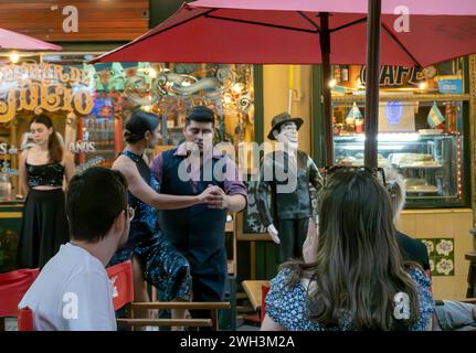 Tourists enjoy a street tango show in Buenos Aires, Argentina Stock Photo