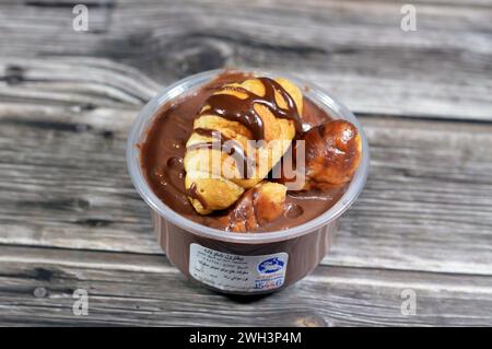 Cairo, Egypt, February 5 2024: Remas Land chocolate profiterole, with Molto croissants stuffed with chocolate, sauce, peanut butter, profiteroles are Stock Photo