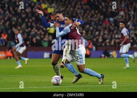 Chelsea's Enzo Fernandez (left) and Aston Villa's Youri Tielemans battle for the ball during the Emirates FA Cup fourth round replay match at Villa Park, Birmingham. Picture date: Wednesday February 7, 2024. Stock Photo