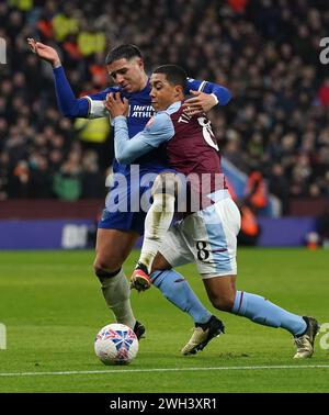 Chelsea's Enzo Fernandez (left) and Aston Villa's Youri Tielemans battle for the ball during the Emirates FA Cup fourth round replay match at Villa Park, Birmingham. Picture date: Wednesday February 7, 2024. Stock Photo