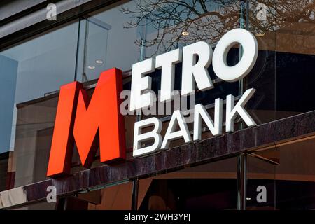 Cardiff, Wales, UK - December 6 2023: An illuminated Metro Bank Sign in Queen Street, Cardiff, Wales, United Kingdom Stock Photo