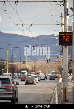Smart digital radar display indicator device or vehicle activated speed sign showing speeding over the speed limit in residential neighbourhood area in Sofia, Bulgaria Stock Photo