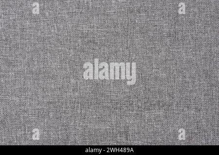 Texture of grey canvas fabric. Gray linen cloth background. Stock Photo