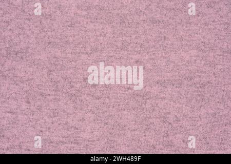 Pink knitted fabric, draped jersey cloth background. Knitted background of knitwear. Stock Photo