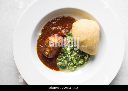 Nigerian okro and stew in a white plate, top view of okro soup Stock Photo