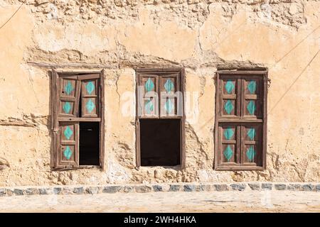 Middle East, Saudi Arabia, Tabuk, Duba. Wooden window shutters on an old building in the port city of Duba. Stock Photo
