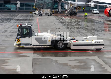 The towbarless tractor (TBL) on a runway of an international