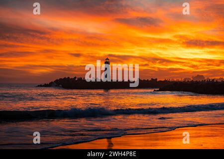 Santa Cruz Breakwater Lighthouse at sunset Stock Photo