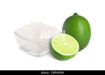 Limes and salt isolated on white. Margarita cocktail ingredients Stock Photo