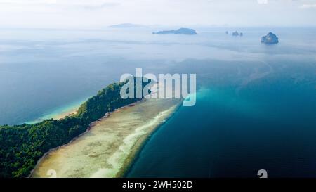 Drone top aerial top view from above at Koh Kradan a tropical island with palm trees soft white sand, and a turqouse colored ocean in Koh Kradan Trang Thailand Stock Photo