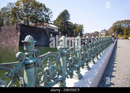 Bronze railings at the road edge leading to the Niju-Bashi bridge at the Japanese Imperial Palace in Tokyo. Stock Photo