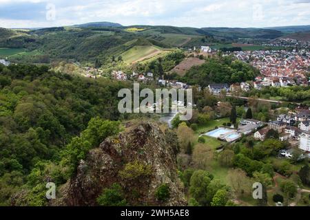 Bad Munster, Germany - May 12, 2021: Aerial view of Rheingrafenstein Castle on a hill over the town of Bad Munster and the Nahe River, surrounded by g Stock Photo