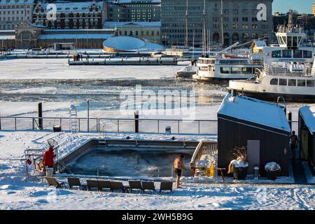 Snow covered deck of Allas Sea Pool on a cold and sunny winter day in Helsinki, Finland Stock Photo